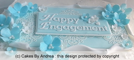 custom-cake-blue-5-petal-blossoms-plaque-lace-frosted